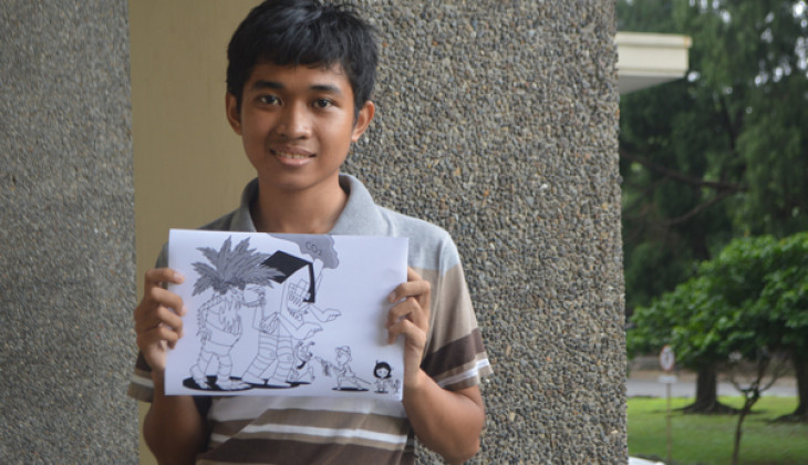 Mahasiswa Kehutanan UGM Menang Kontes Editorial Cartoon FAO. Michael Jose menunjukkan karyanya yang berhasil terpilih sebagai yang terbaik dalam konters tersebut.