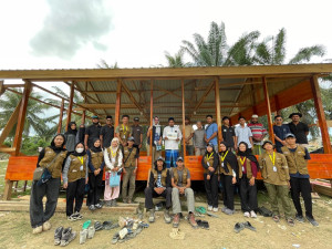 UGM KKN-PPM students and community members at the village hall inauguration in North Aceh.