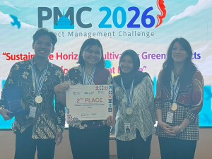 Agile-gilean team members from UGM posing after winning second place at PMC 2026 in Bandung.